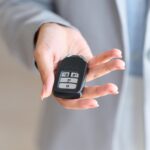 woman handing over car keys